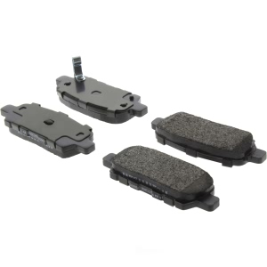Centric Posi Quiet™ Extended Wear Semi-Metallic Rear Disc Brake Pads for 2010 Nissan Sentra - 106.09050